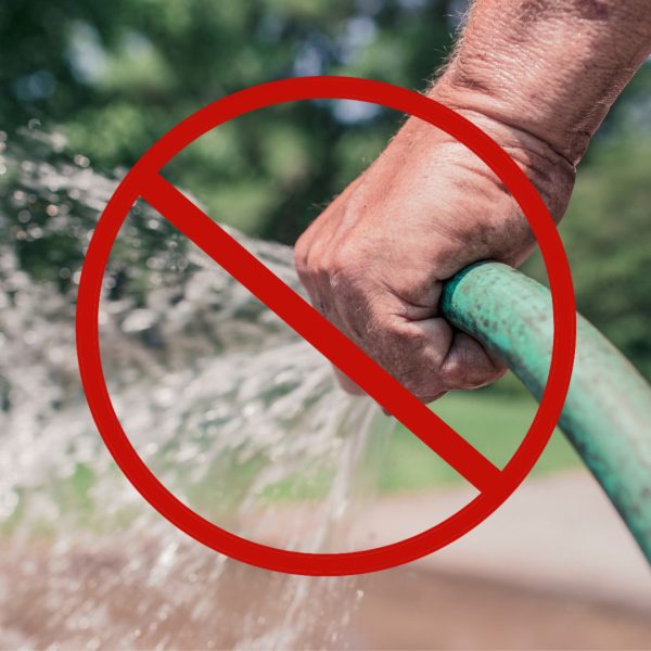 Person holding hose with a slash through it