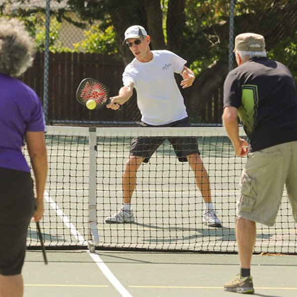 couples playing on a court