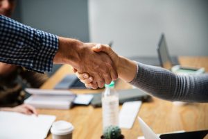 Handshake between man and woman