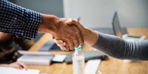 Handshake between man and woman