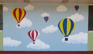 finished wall of air balloons drawn on the wall