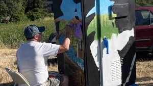 a person paints flowers in a firefighter