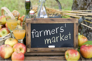 farmers' market sign on chalk board