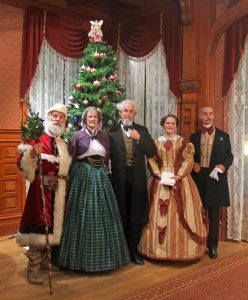 Dickens group posing in front of a christmas tree in Falkirk Cultural Center