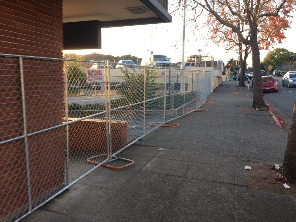 Fifth and B street with a fence