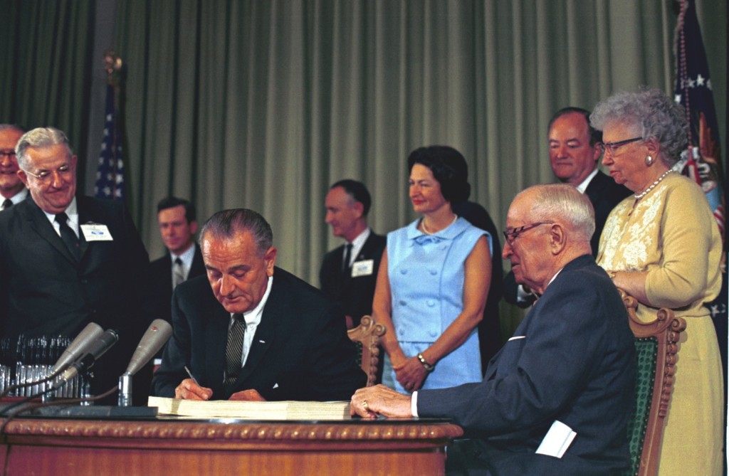 LBJ signing Medicare into law