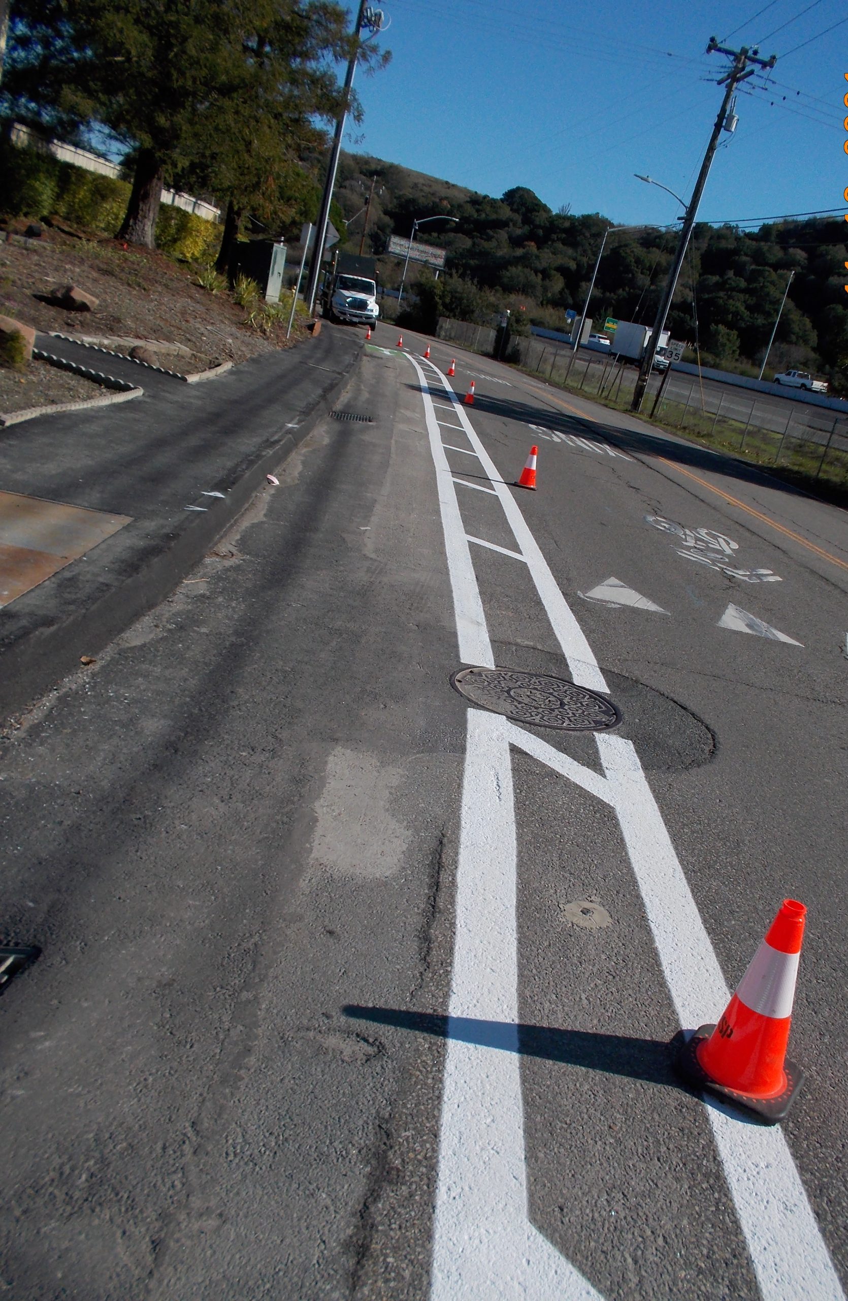 Final paving and striping on Francisco Boulevard East