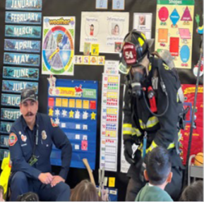 Fire Fighter talking to students 