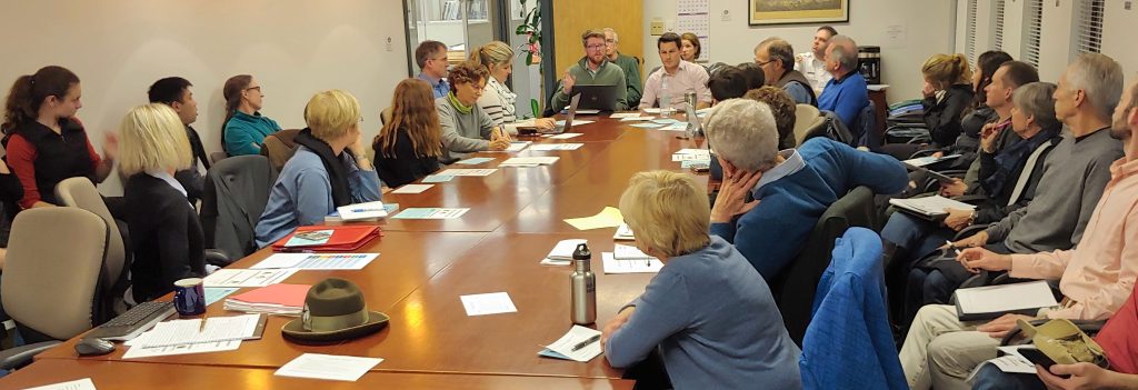 Climate Action meeting around table