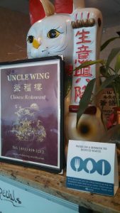 Uncle Wing Menu and We Ask Sign