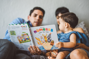 parents and child reading book