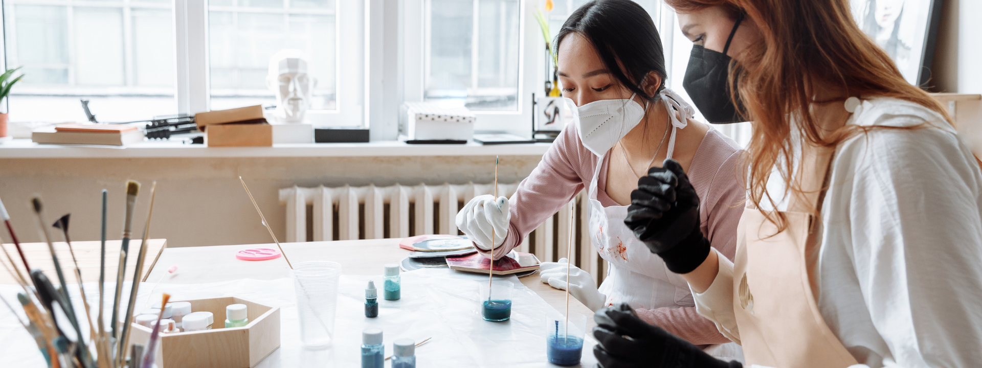 two scientists working on beakers in a lab