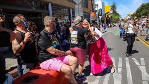 Councilmember Lopez Hugs at Pride Parade