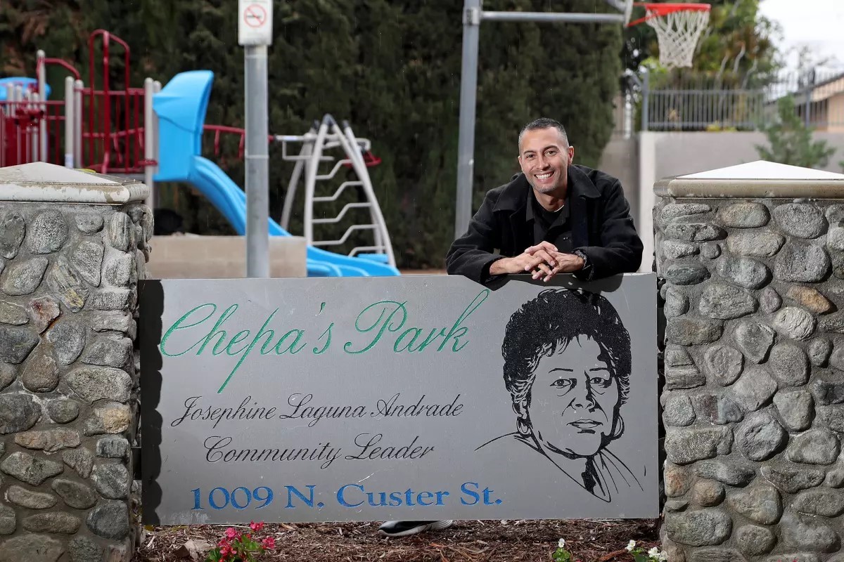 Man in front of park dedicated to Josephine Chepa Andrade