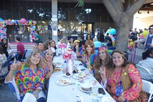 City Employees celebrate Halloween together. This group of employees are all dressed in the theme of the 60s era