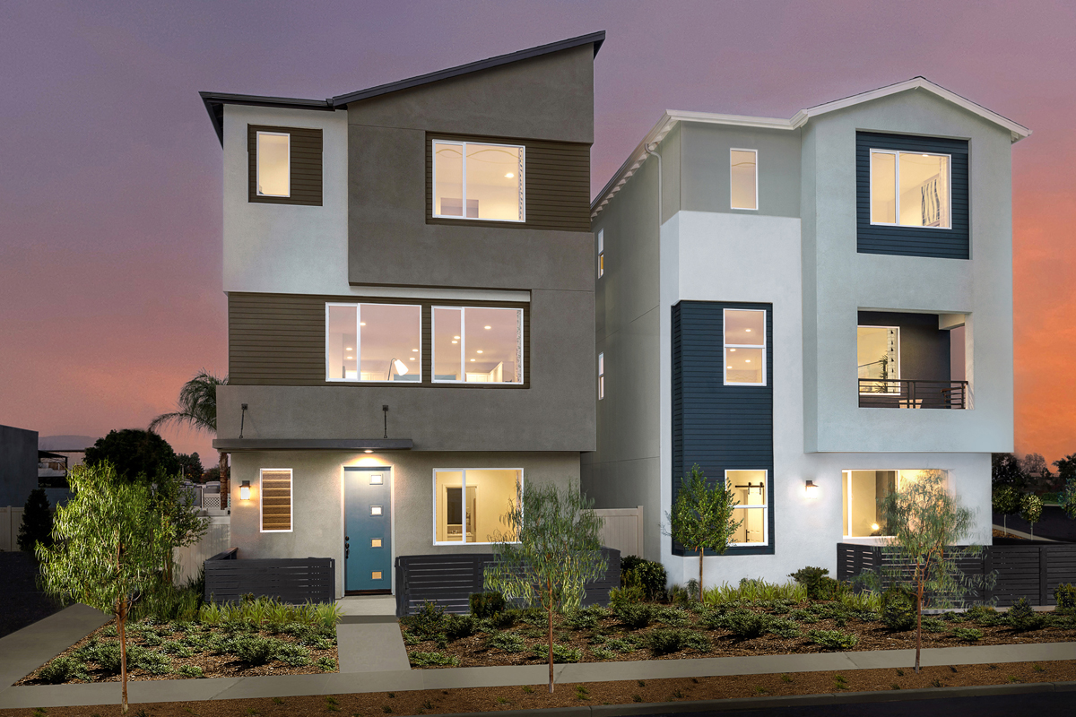 Proposed illustrations of what two different new townhomes will look like. The one on the left is a brown building with large, square windows and a blue front door, and the one on the right is a grey and white building with navy blue areas, and it also has large square windows.