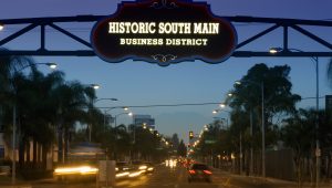 Nighttime street view of the Historic South Main Business District sign