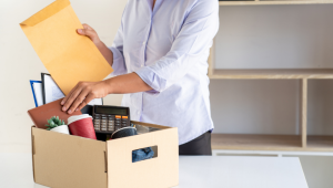 person with envelope sorting through items