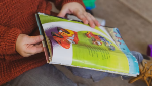 child holding colorful book