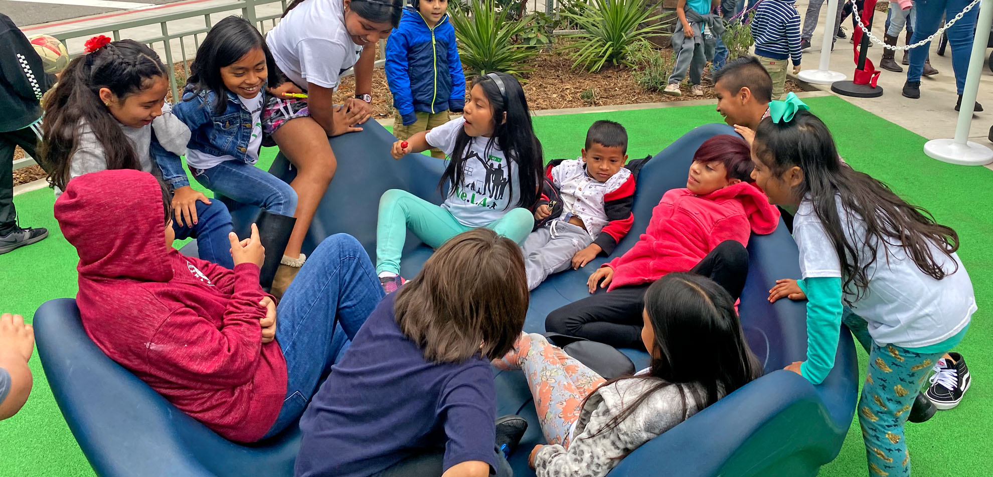 kids enjoying the new playground at Mariposa park