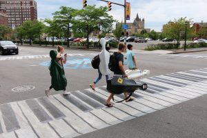 music students crossing crosswalks painted like a piano
