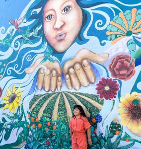 Child near a mural in downtown Santa Ana
