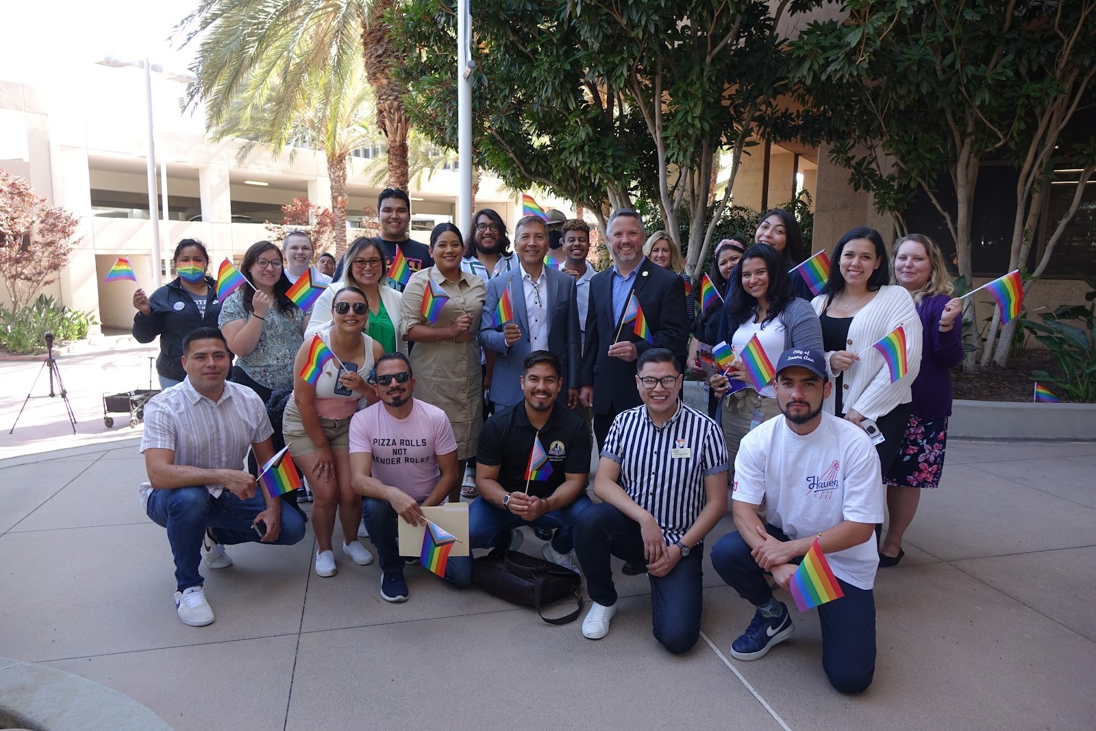 Pride flag raising ceremony group photo