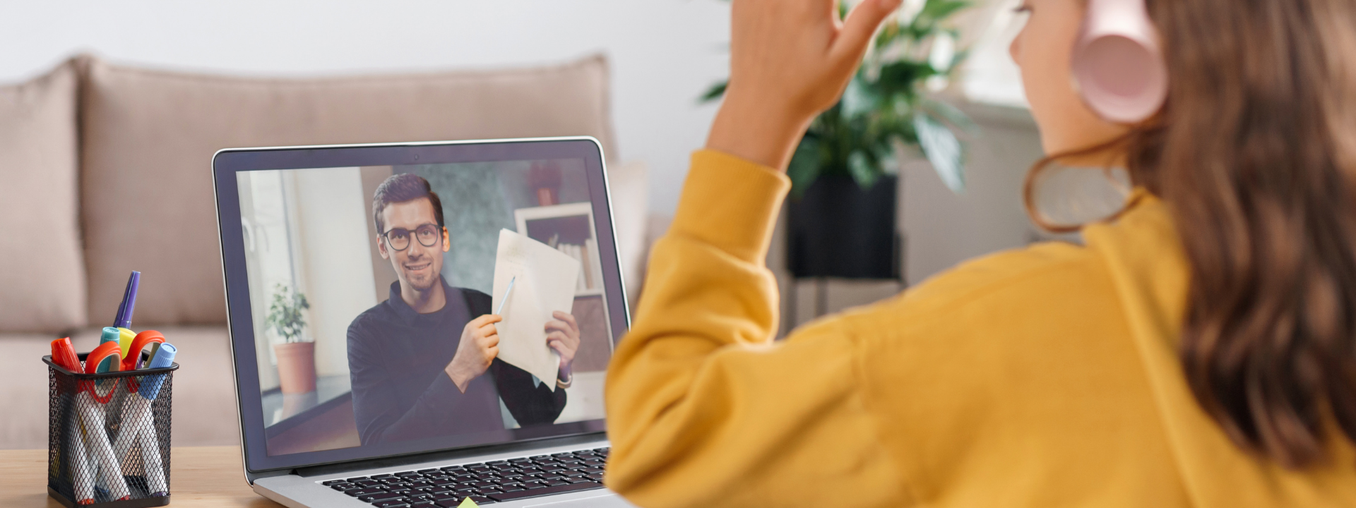 man on laptop helping student