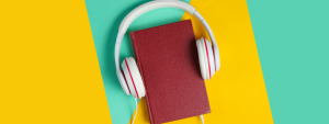 Red book with headphones attached