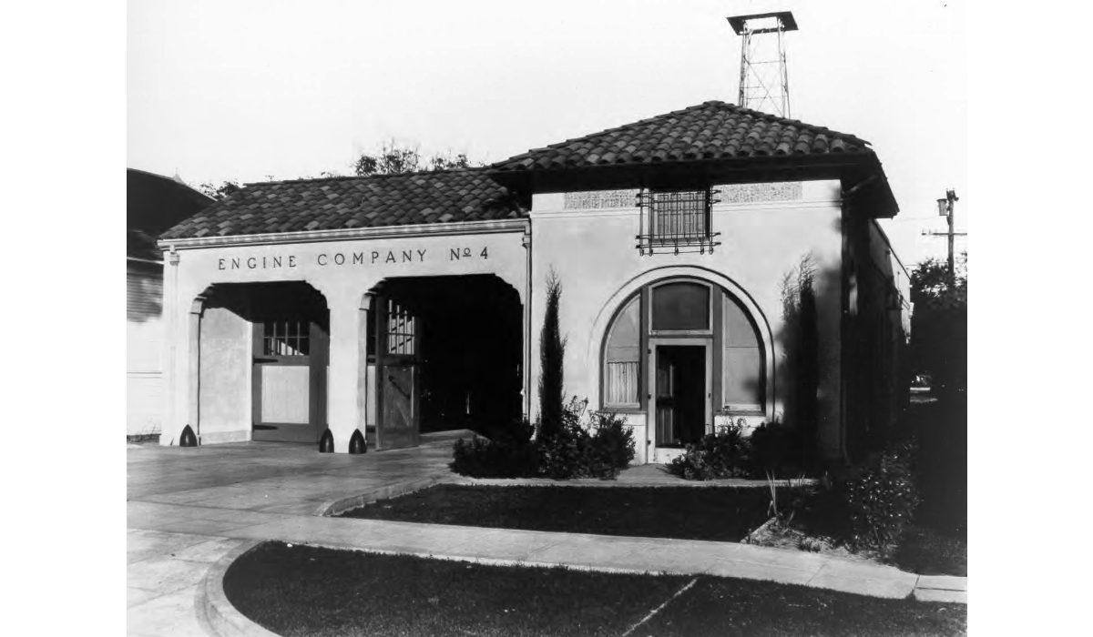 Black and white image of a small fire station.