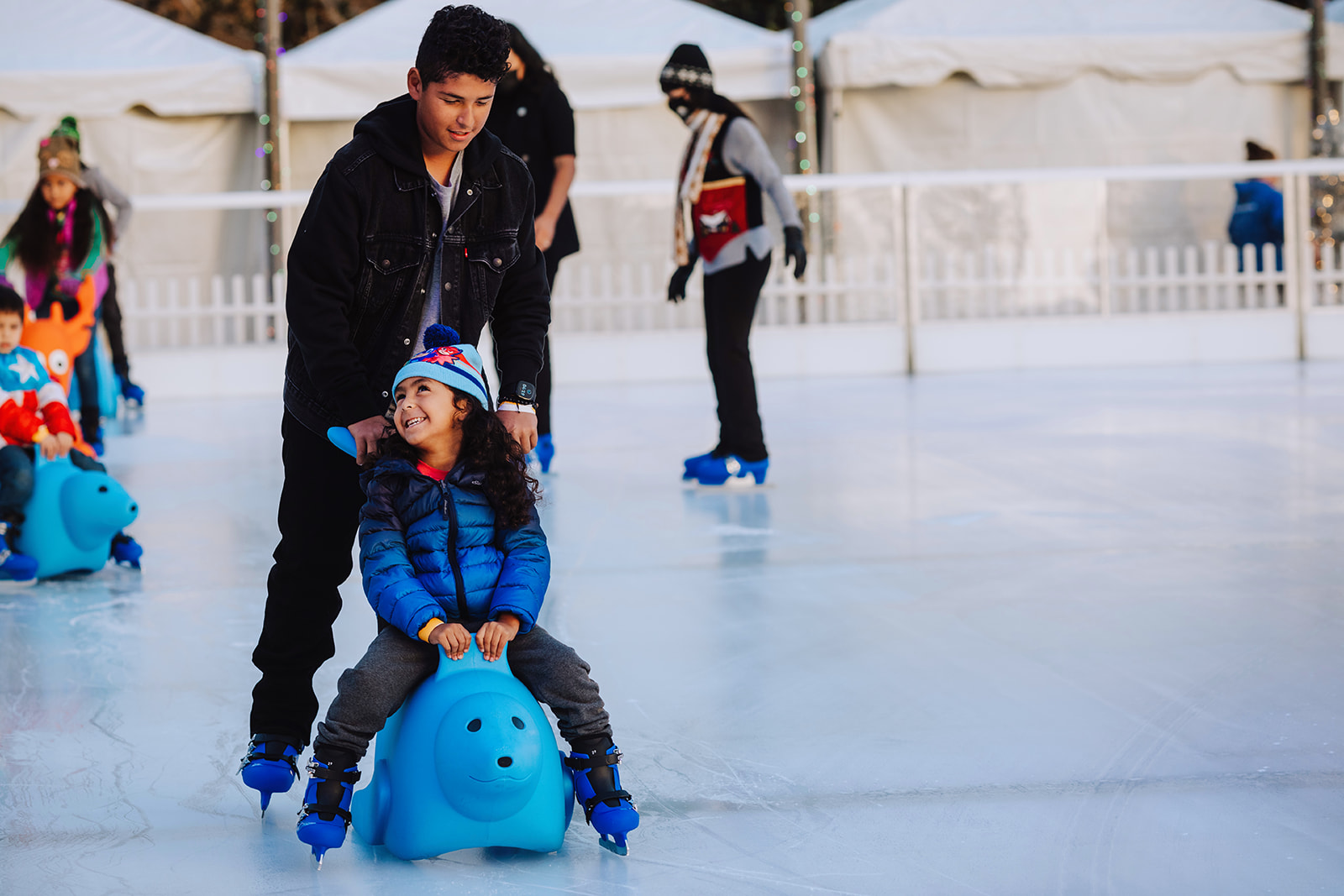 Winter Village - kid on blue seal