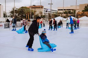 Families ice-skating at Winter Village