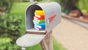 Colorful cartoon books in real mailbox