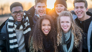 teens in front of a sunrise