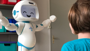 Astound robot facing a child