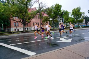 People running on broadway street