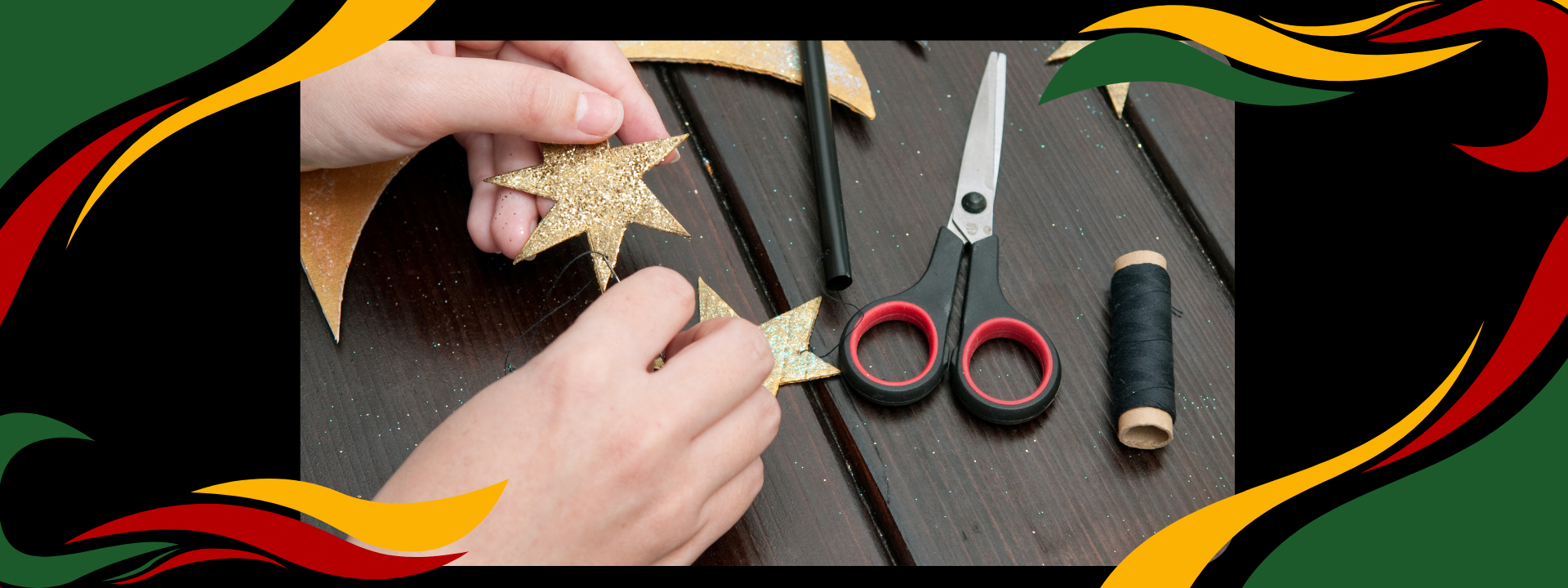 hands holding a golden star with craft items