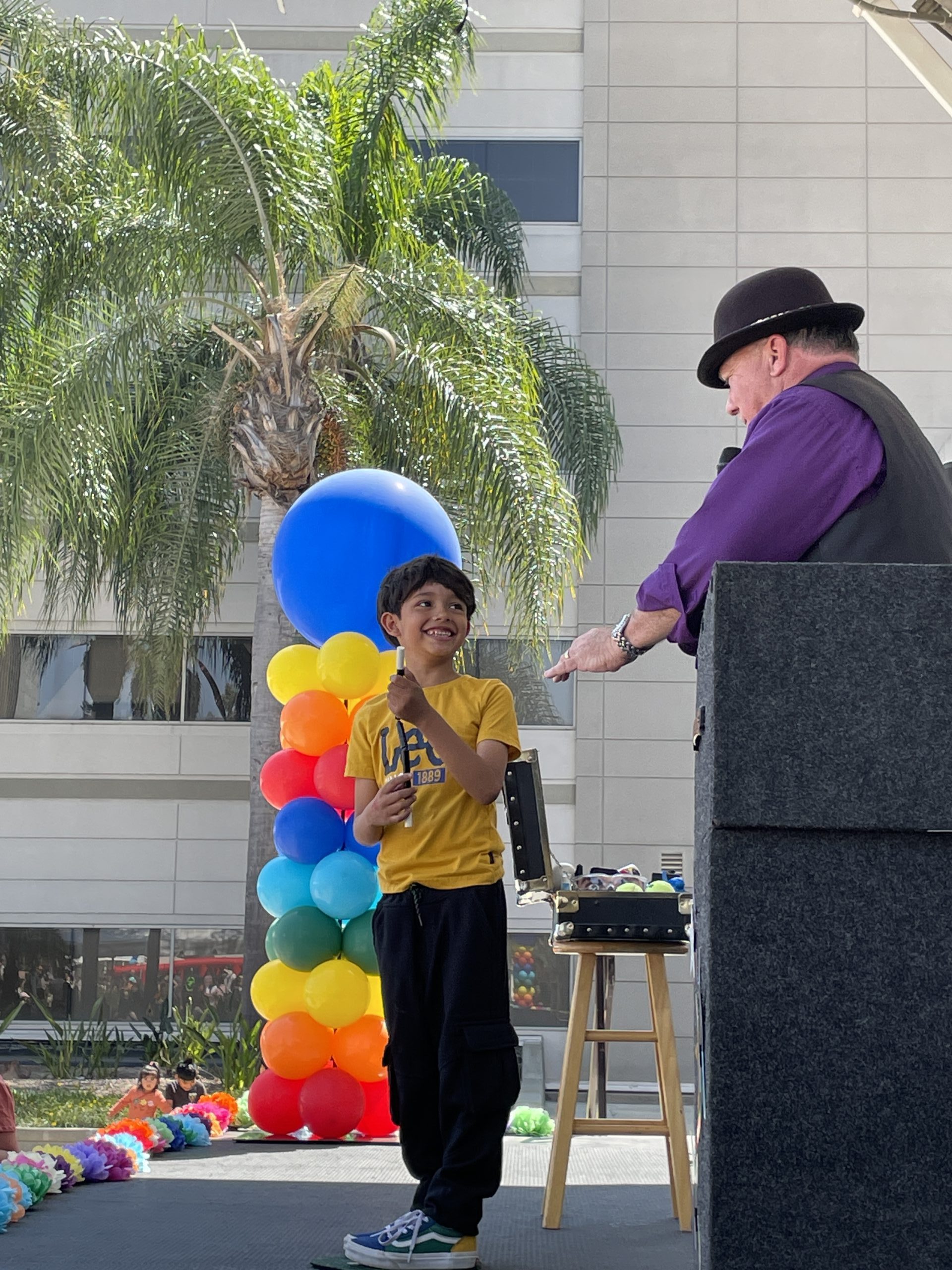 Dia De Los Niños Magician on stage