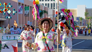 women at Fiestas Patrias Parade on Main Street