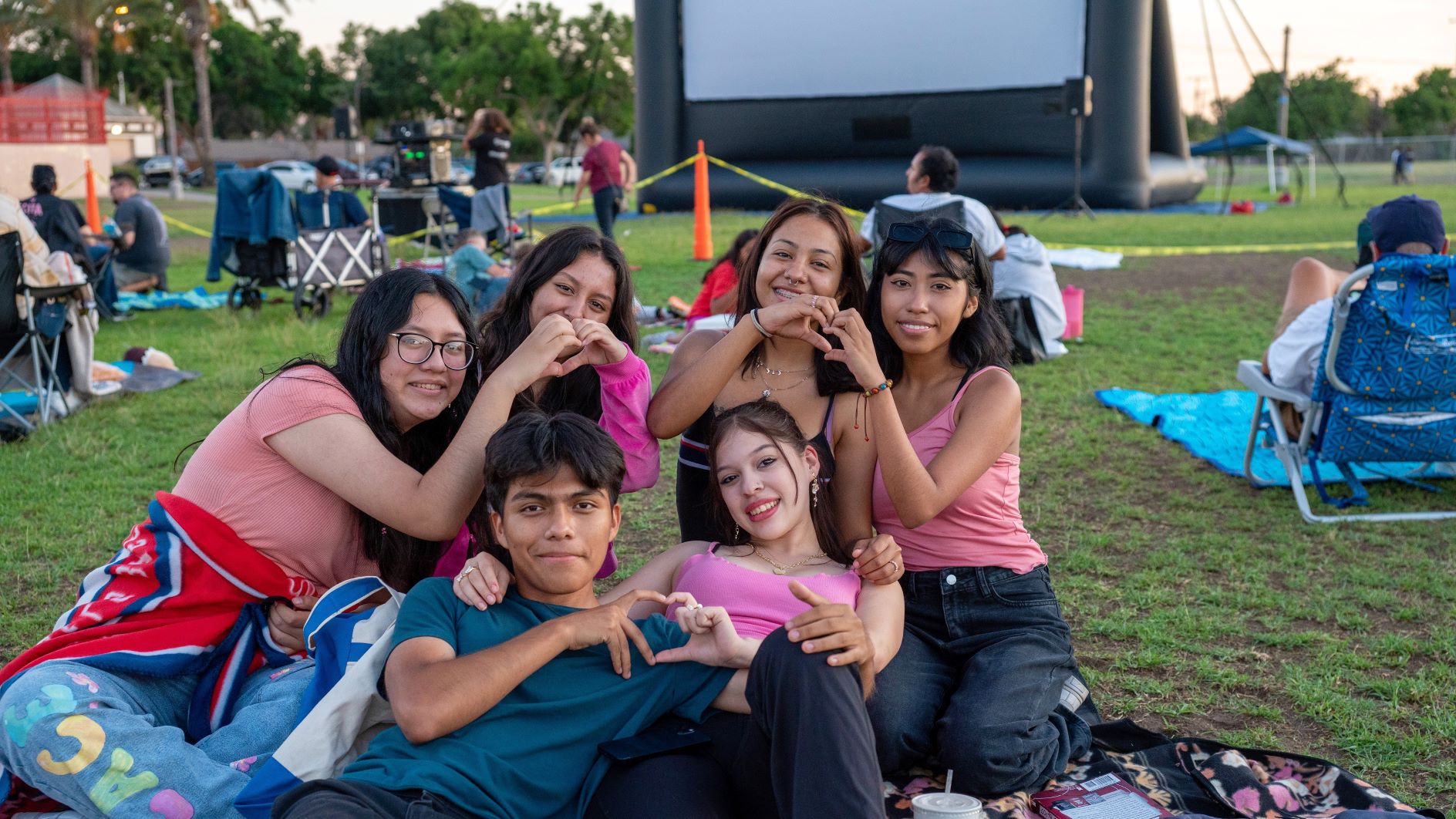 Youth in front of inflatable screen at park