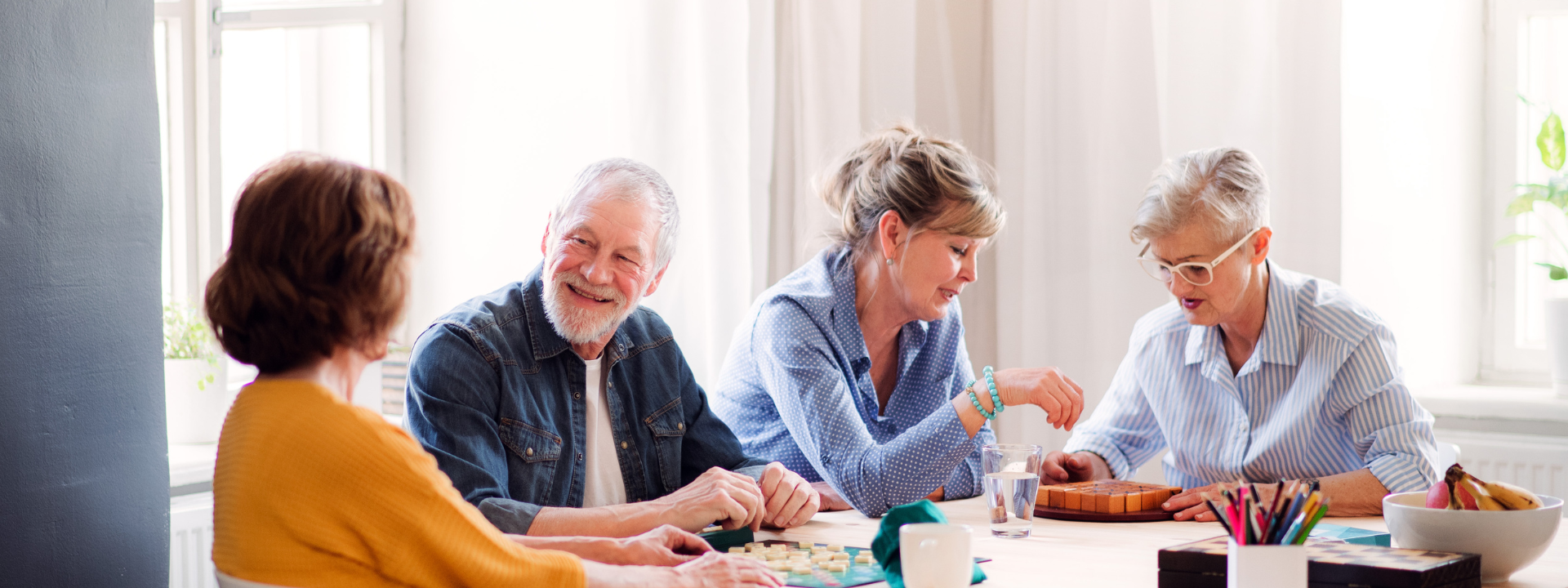 group of adults talking in a table