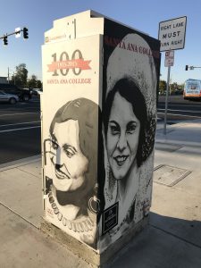 Utility box with two portraits designed by Santa Ana College mural team