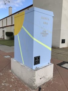 Utility box with art reading "Santa Ana The Golden City"