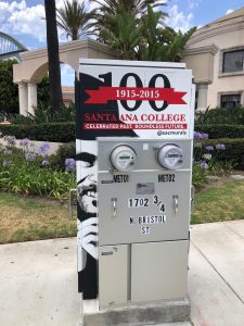 Utility box with art reading "Santa Ana College: Celebrated Past. boundless future."