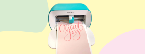 Cricut Joy in colorful background and paper with its name printed