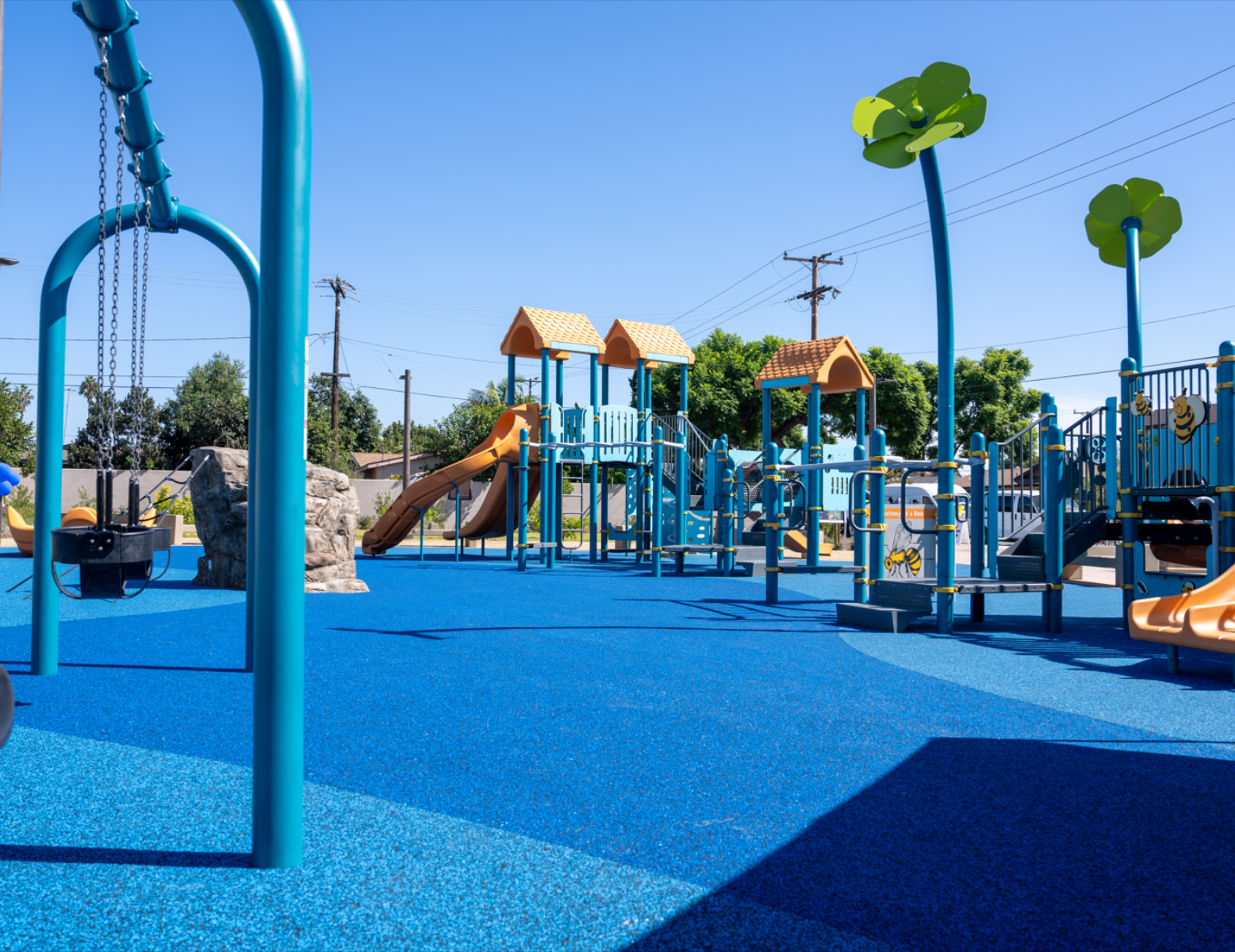 Children Playing On Playground In City Park Engaged In Football