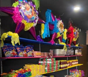 Mi Dulce Tienda Image Piñatas and candy on shelf