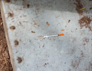 needle on sidewalk