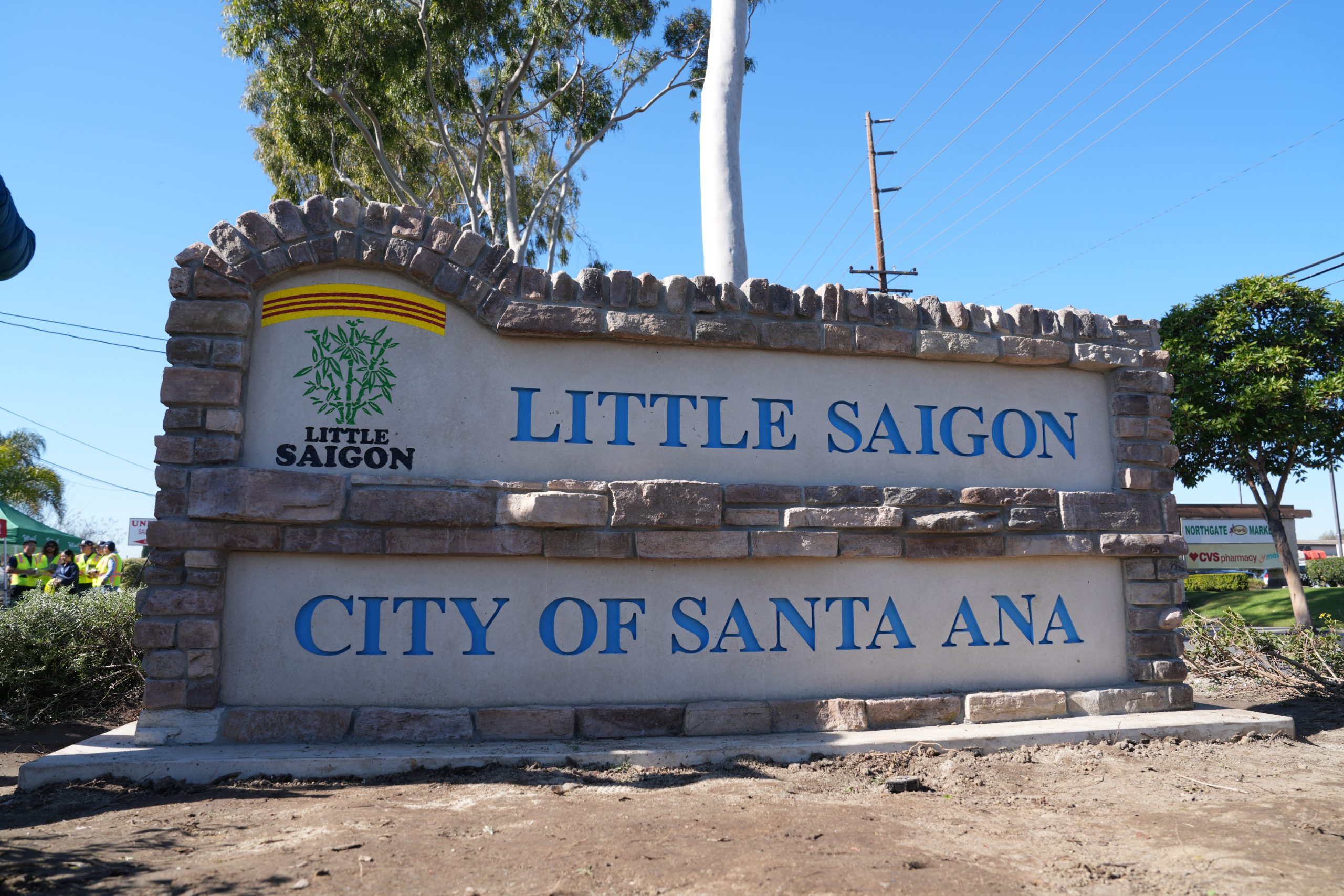 A stone and concrete sign that says "Little Saigon, City of Santa Ana."