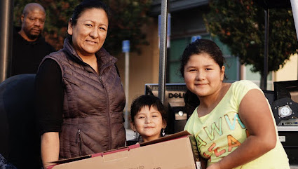 Family receiving laptop